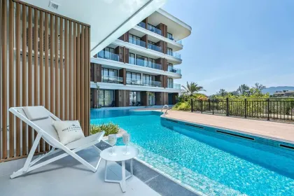 Студия с выходом в бассейн и видом на пляж в Kora Beach Residences